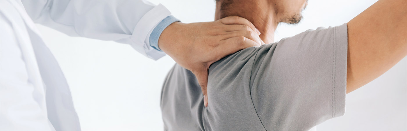 doctor with hand on patients back
